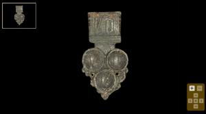 Circa 15th century AD. An openwork bronze strap end comprising a trapezoidal plate.jpg